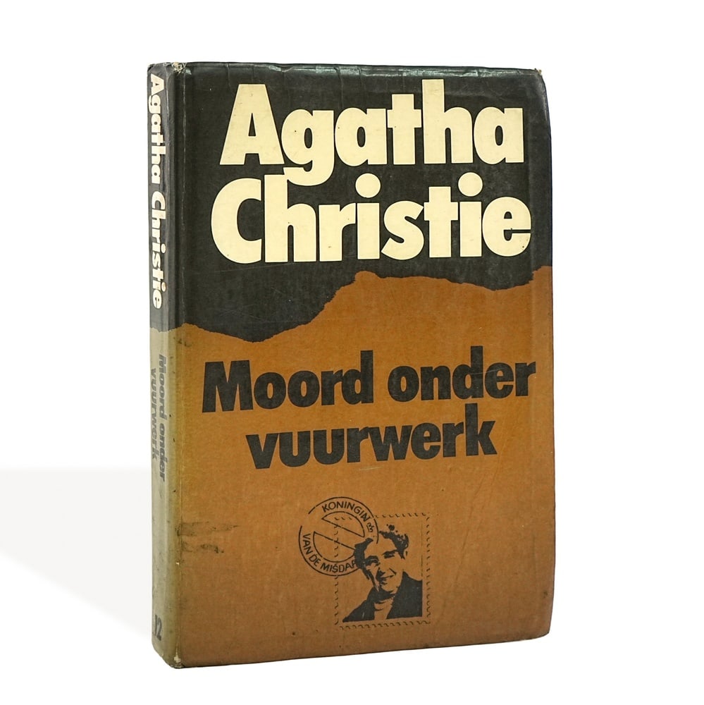 AGATHA CHRISTIE SIGNED "MOORD ONDER VUURWERK" BOOK: 7 x 4 5/8 in (17.8 x 11.8 cm) Provenance and Authentication: According to the Letter of Authenticity (LOA) and Certificate of Authenticity (COA) provided by the consignor, this collectible was