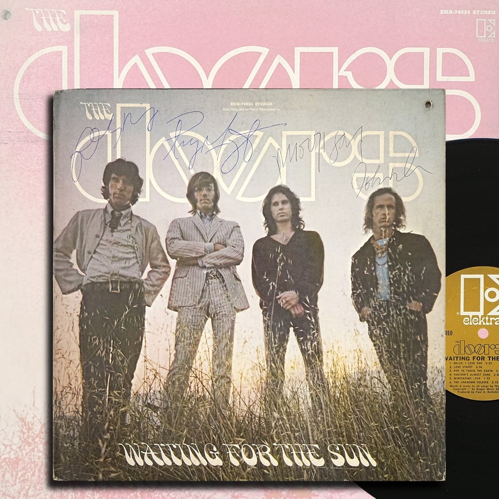 THE DOORS FULLY SIGNED "WAITING FOR THE SUN" LP: 12 1/4 x 12 1/4 in Provenance and Authentication: According to the accompanying documentation provided by the consignor, the signatures have been examined with reference to multiple factors,