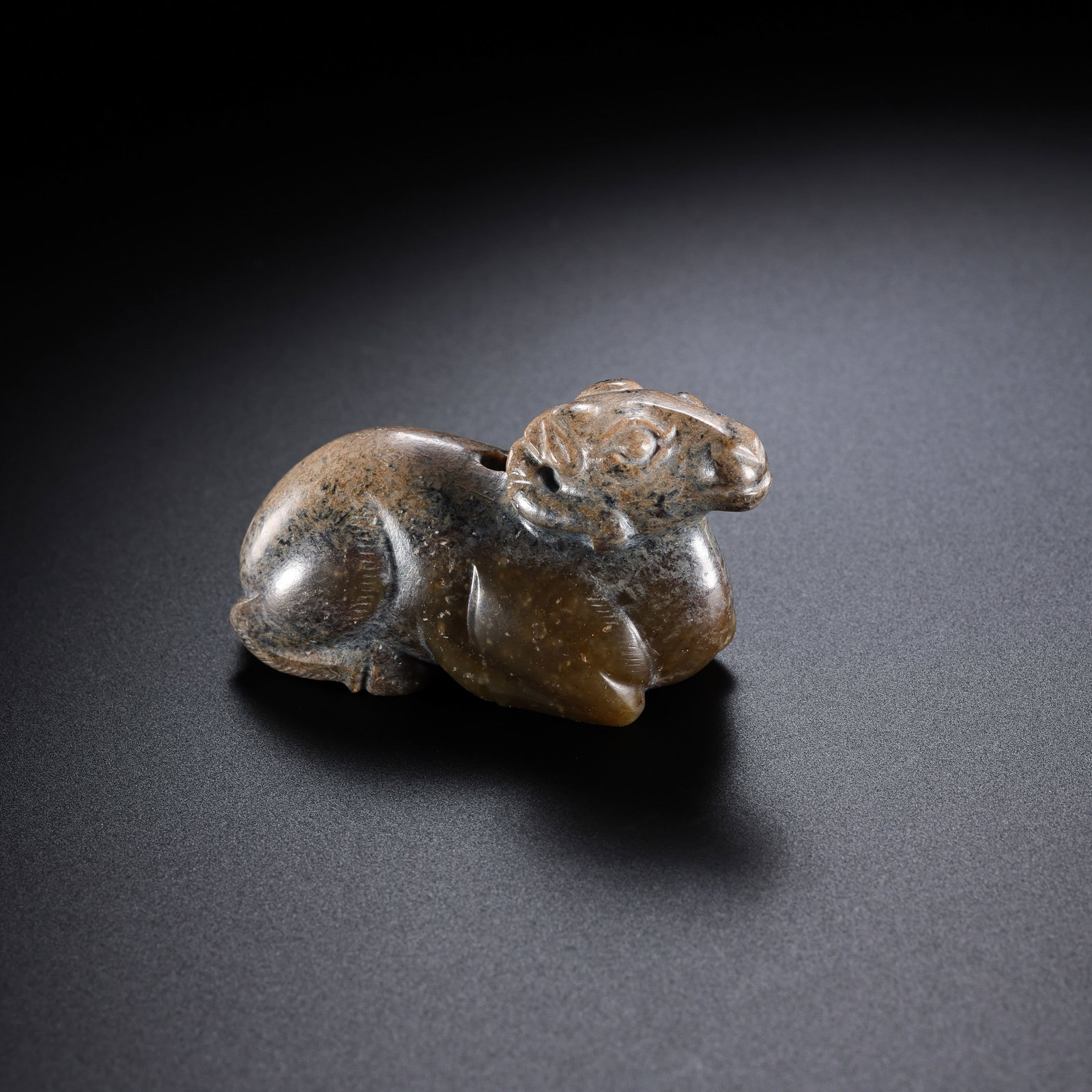 Jade sheep from the Han Dynasty in China: H. 3 cm. W. 5.6 cm. Weight. 54 gram.