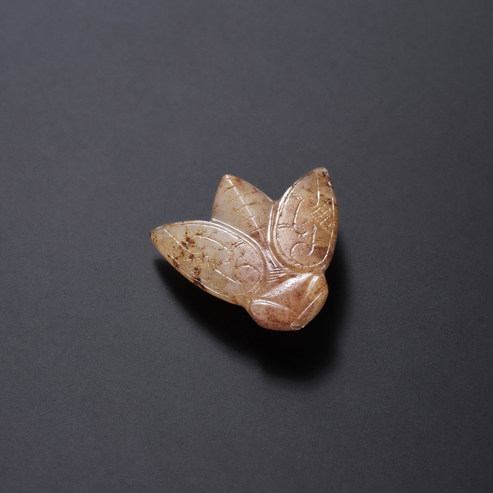 Jade Cicada from the Han Dynasty in China: L. 2.6 cm. W. 2.6 cm. Weight. 3.5 gram.