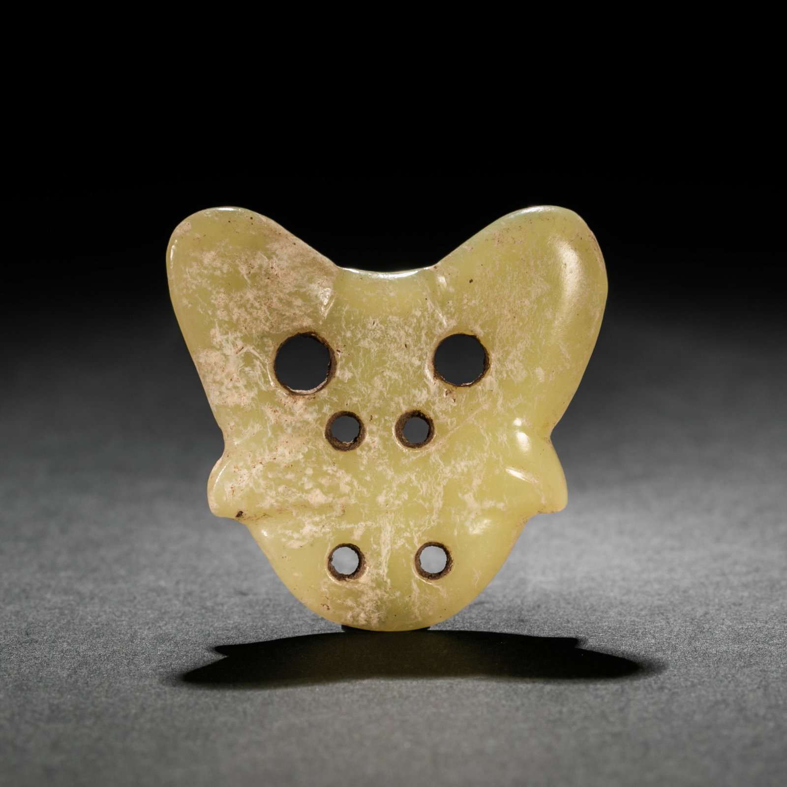 Jade artifacts from the Hongshan Culture period in China: H. 5 cm. W. 4.5 cm. Weight. 16.4 gram.