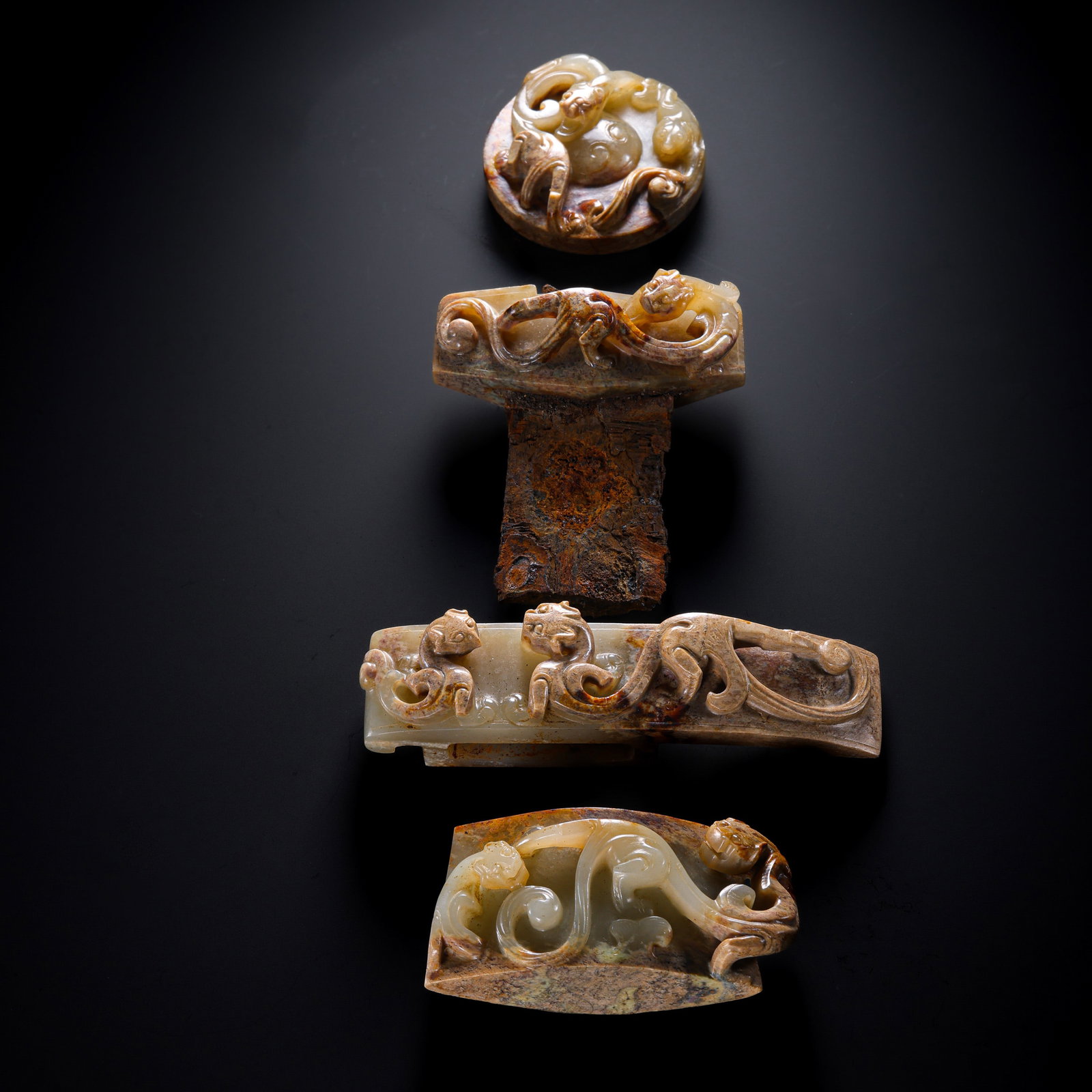 A set of jade sword ornaments with dragon motifs from the Han Dynasty of China (1 of 19)