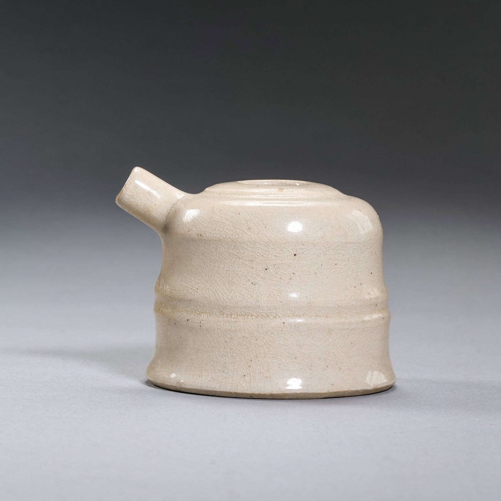 White porcelain water dropper from Gongxian kiln, Tang Dynasty, China: H. 5 cm.