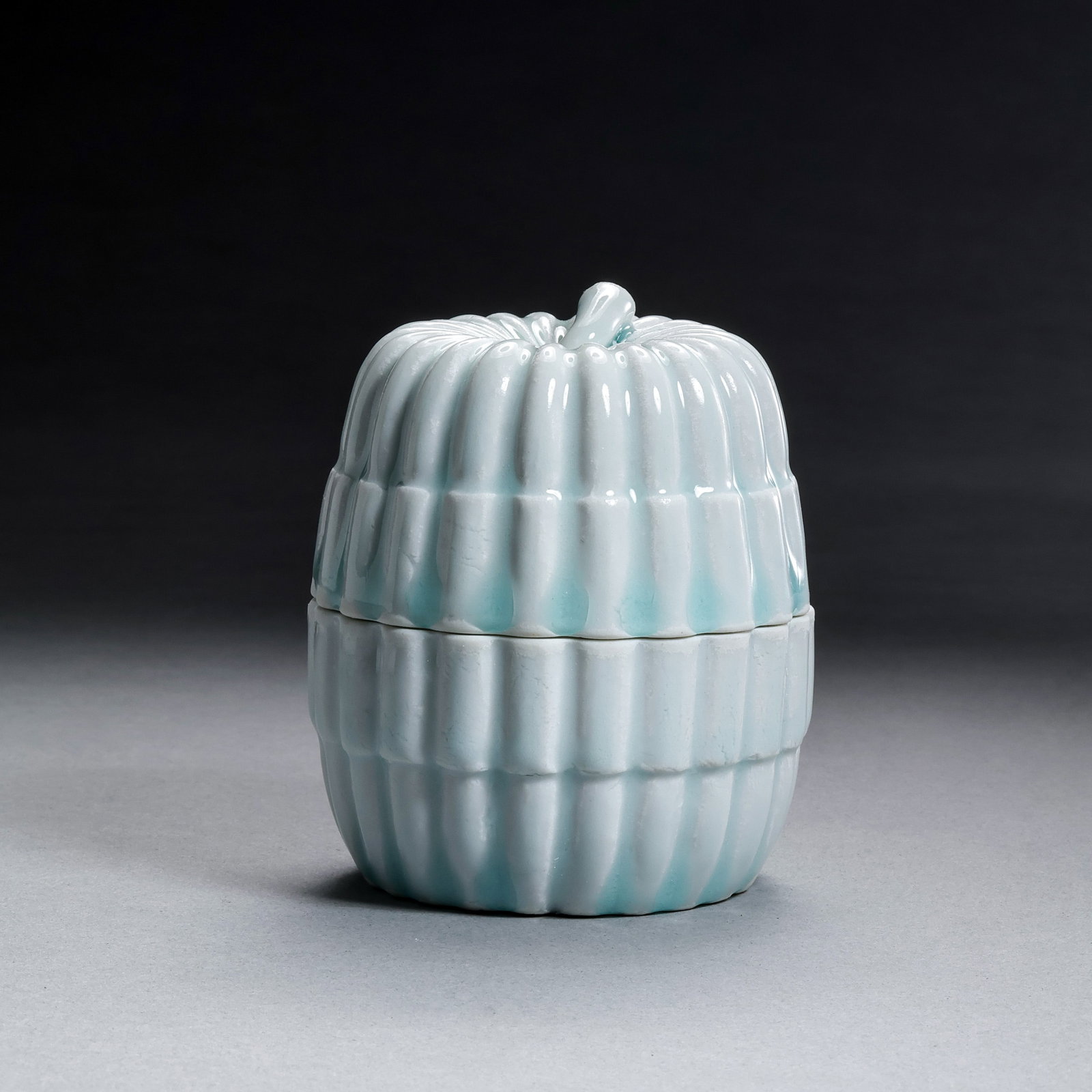 Southern Song Dynasty Chinese Hutian Kiln Shadow-Celadon Glazed Melon-Shaped Covered Box: H. 7.5 cm. W. 6.5 cm.