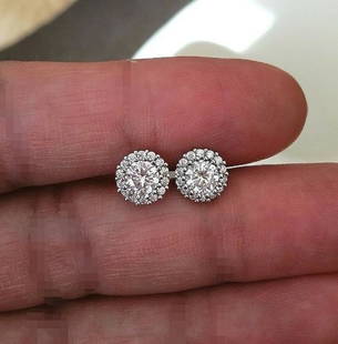 EARRINGS 18K pair of diamond studs with halo jacket: 18k gold pair earrings, 8mm diameter. center diamond total weight 1.00ct side diamonds total weight 0.20ct H-I color VS-SI clarity
