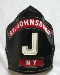 St.Johnsburg NY Fire Dep.Cairns leather Helmet Shield.: St.Johnsburg NY Fire Dept. Leather Helmet Shield. measures 6 1/4" tall and 5" wide