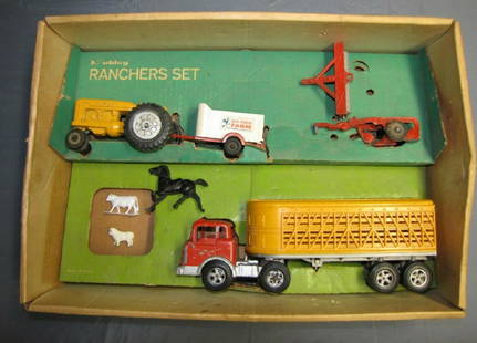 Hubley Vehicle Rancher's set #1048 +Box: Hubley Vehicle Rancher's set #1048 +Box Includes yellow Tractor, while animal trailer, 2 row plow, disc/roller, red Tractor and Yellow stock trailer. sheep, cow.