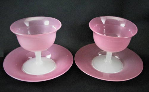 STEUBEN BOWL Pair Rosaline Sherbets compote and: pair of pink sherbets with white stems and matching pink under plates by Steuben Glass. These beautiful sherbets are in Steuben's Rosaline glass with Alabaster stems and matching Rosaline glass under