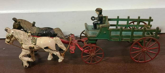 KENTON VEHICLE DRAWN HORSE WAGON 15.5" 1930: Kenton cast iron horse drawn wagon. Made in 1930's It is 15 1/2" long and 3 1/2" wide. There is some minor paint loss. The axel on the wagon is very slightly bent. It is all original including the