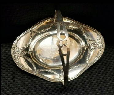 sterling basket with handles: sterling basket with handle stamped MH Sterling Weight: 99 grams 7.5 inches wide