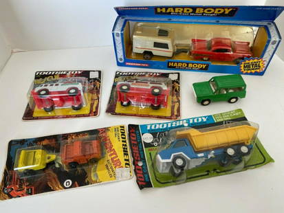 Tootsietoy lot of vehicles: Tootsietoy lot of vehicles. all in original packaging except for the green vehicle.