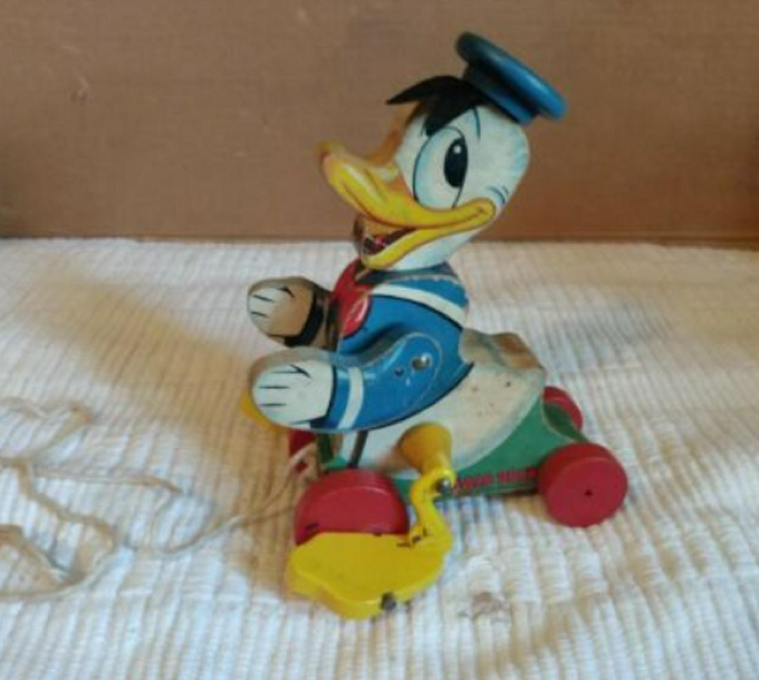 Fisher Price Disney Donald Duck Wooden Pull Toy # 765: Disney Donald Duck Wooden Pull Toy# 75 Used condition, some age spots, rolls & quacks