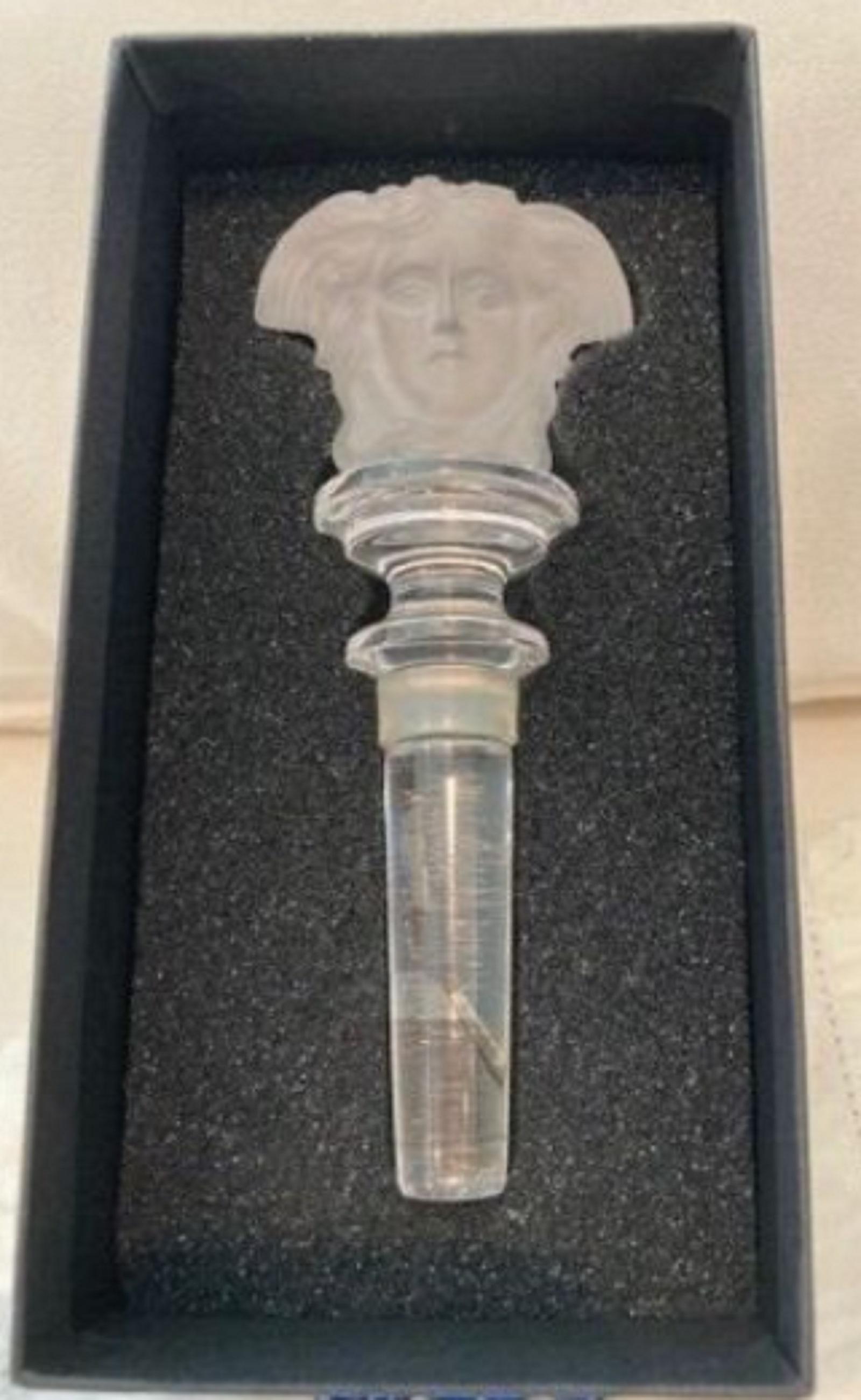 Versace Crystal Wine Stopper with box clear: Versace Crystal Clear Frosted Double Sided Medusa Wine Stopper. Measures approx 5" lenght
