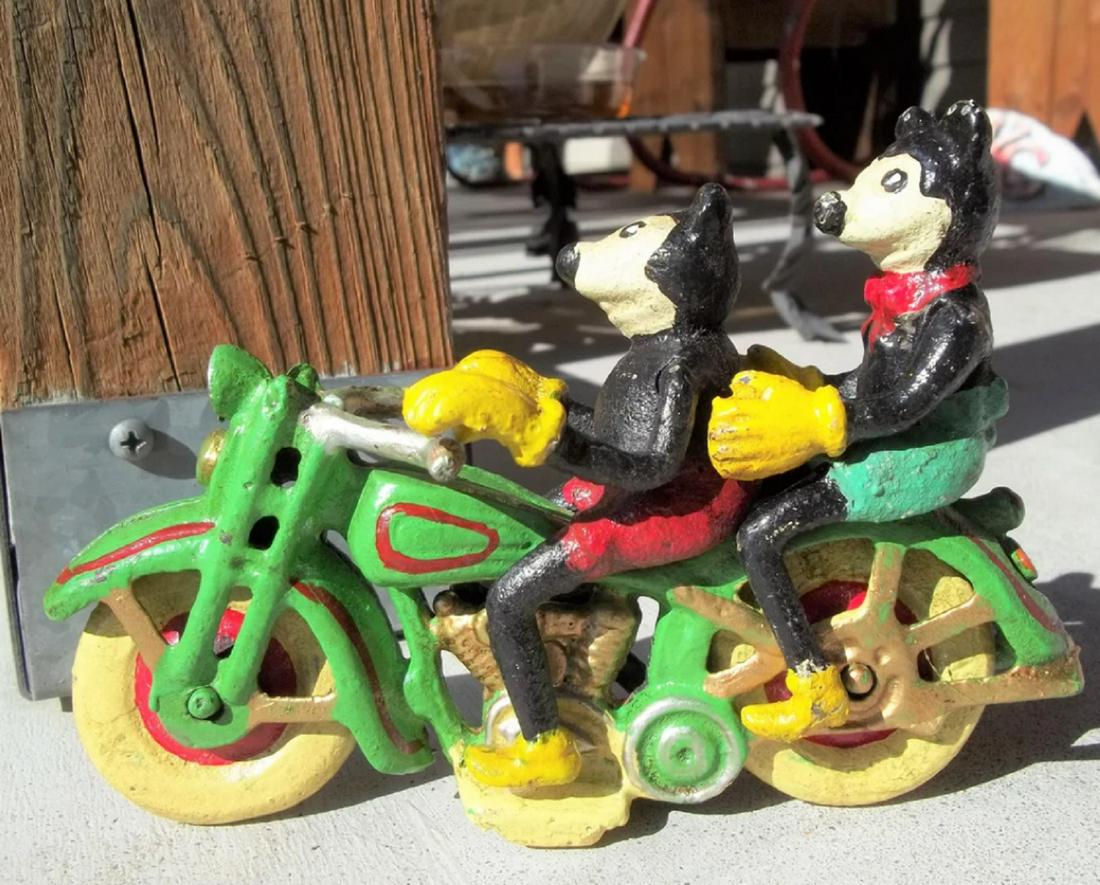 DISNEY CAST IRON motorcycle 6" wide: 2 seater motorcycle with Mickey and Minnie Mouse riding it. Mickey and Minnie are in a sitting position and removable. The motorcycle measures 6 inches long and is 3 inches tall. Mickey and Minnie are