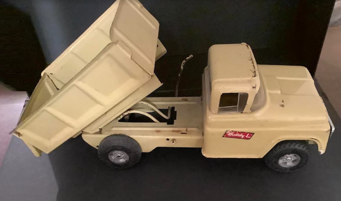 Buddy L Pressed Steel Dump truck 1960 measures 11.25": Buddy L Dump truck tan color 1960 measures 11.25"