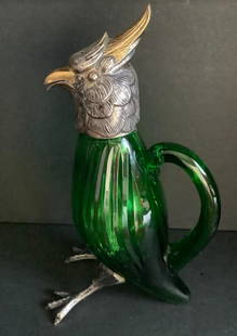 Spanish Sterling Silver EMERALD GREEN CRYSTAL Figural Birds Decanter Cruet: standing bird decanter in green and colored crystal, with ruffled feather collars and naturalistic feet, gilded crests and beaks, hallmarked to mounts the pentagram Spanish sterling silver mark. measu