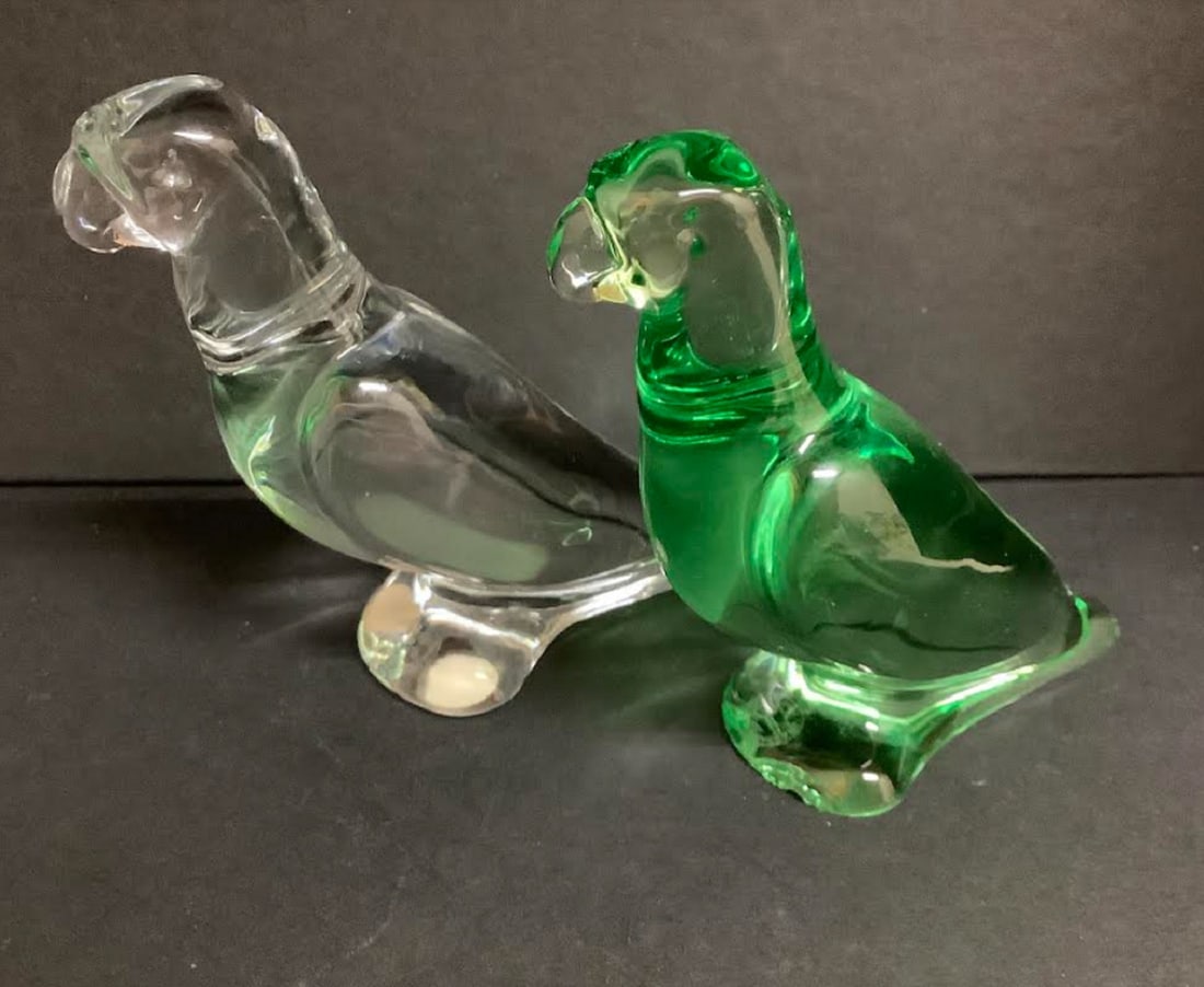 BACCARAT SIGNED PARROT FIGURINES SETO OF 2: Baccarat Signed Parrot Figurines, SETO OF 2 Green And Clear. The green figurine has a slight chip on its bottom but not seen when displayed dimensions are 4.5 inches wide. X 3.5 inches tall
