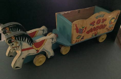 Fisher Price wooden horse and wagon pull toy: Fisher Price wooden horses and wagon pull toy.Measures approx 18 inches long