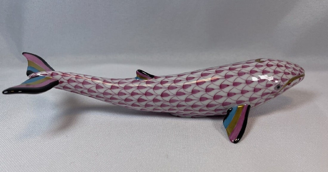 Herend Signed Raspberry Whale Fishnet Figurine: HEREND Whale Hand Painted Porcelain Figurine.It comes in the Raspberry Fishnet Pattern.This Whale measures 6.5 inches long.It is Brand New, with no chips, cracks, scratches, or repairs