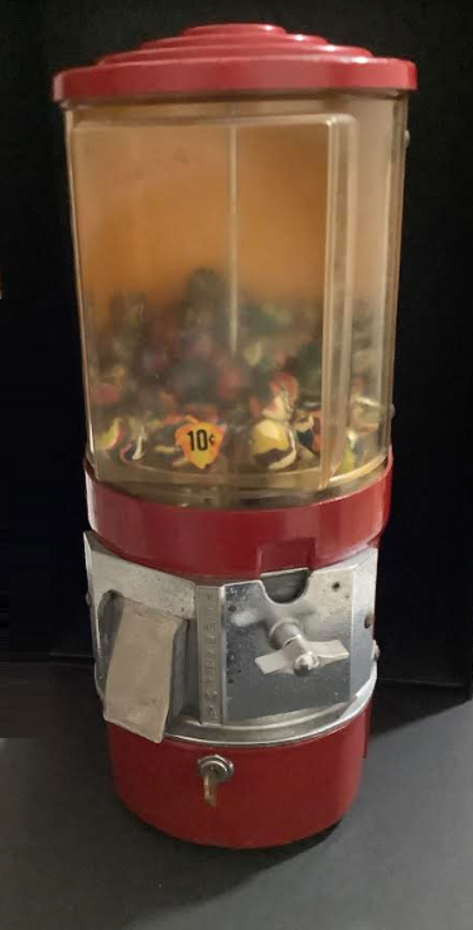 SLOT MACHINE 10 CENTS FILLED WITH SUPER BALLS Glass and Die Cast Metal Ball Coin Machine. This: SLOT MACHINE 10 CENTS FILLED WITH SUPER BALLS Glass and Die Cast Metal Ball Coin Machine. This Ball machine is painted bright red and features a cylindrical globe. Contains a 10¢ Acorn sticker and st