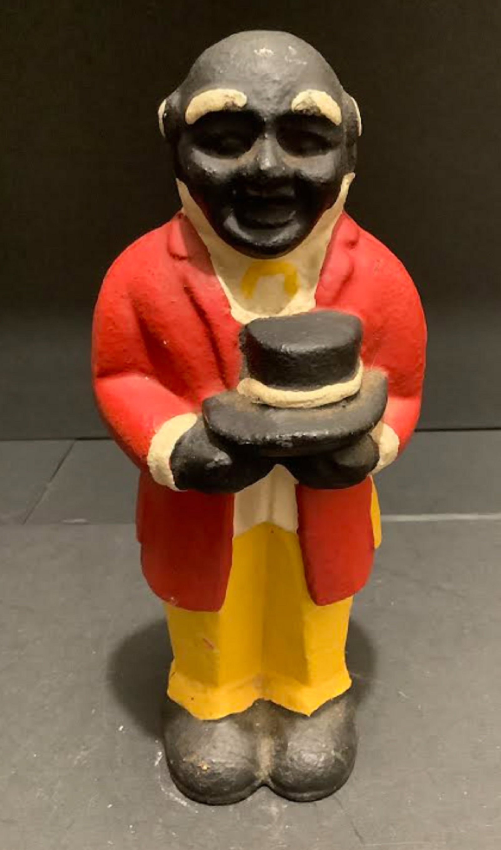 BLACK AMERICANA UNCLE MOSE CAST IRON BANK SCULPTURE FIGURINE: BLACK AMERICANA UNCLE MOSE CAST IRON BANK SCULPTURE FIGURINE CAST IRON BANK SCULPTURE FIGURINE Measures approx 7 3/4 inches tall x 3.25 inches wide
