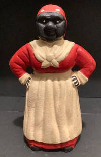 BLACK AMERICANA AUNT JEMIMA CAST IRON BANK SCULPTURE FIGURINE: BLACK AMERICANA AUNT JEMIMA CAST IRON BANK SCULPTURE FIGURINE Measures approx 11 inches tall x 6.5 inches at widest point