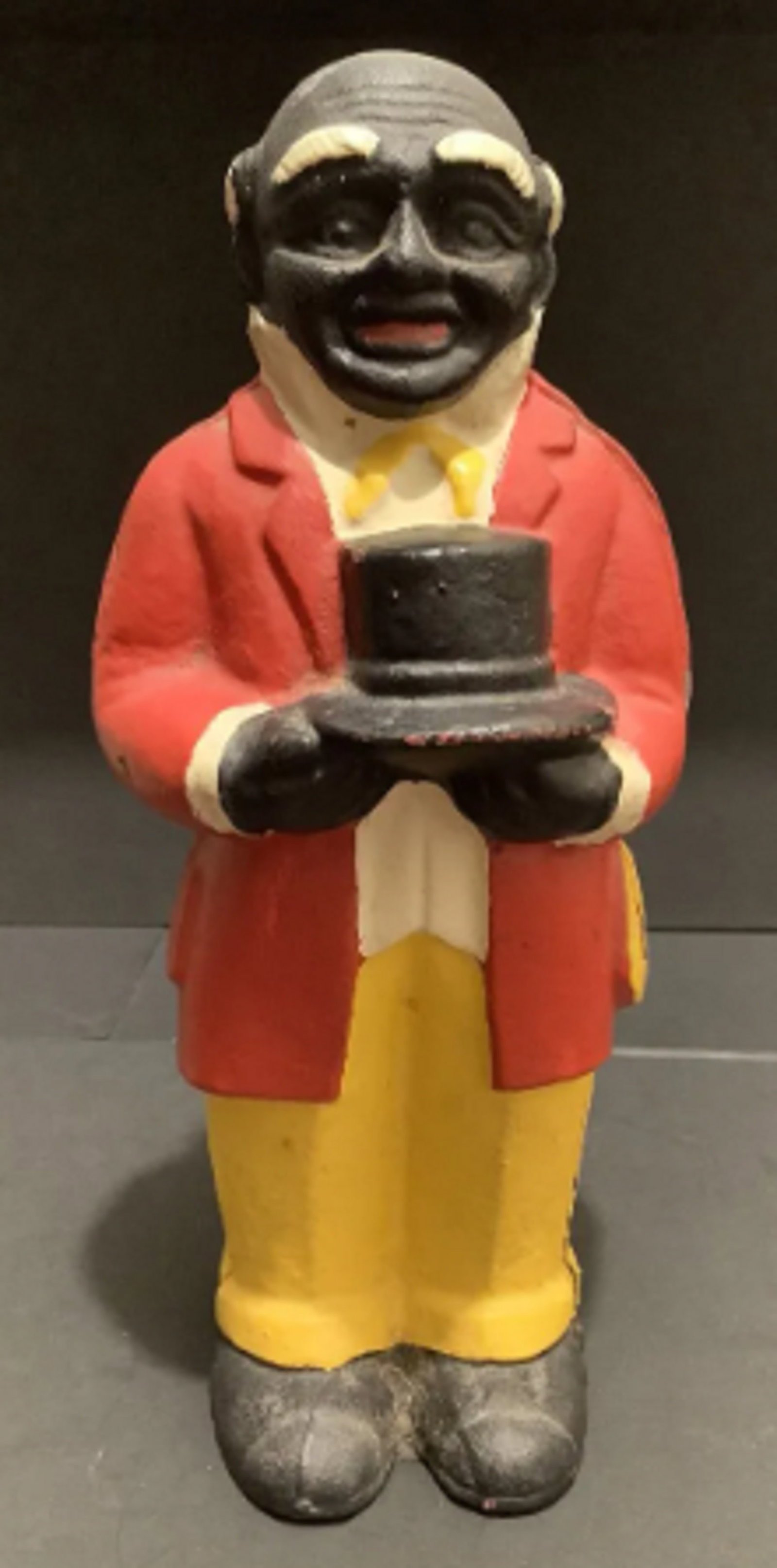 BLACK AMERICANA UNCLE MOSE CAST IRON BANK SCULPTURE FIGURINE: BLACK AMERICANA UNCLE MOSE CAST IRON BANK SCULPTURE FIGURINE MEASURES APPROX 11 INCHES tall 5 INCHES wide