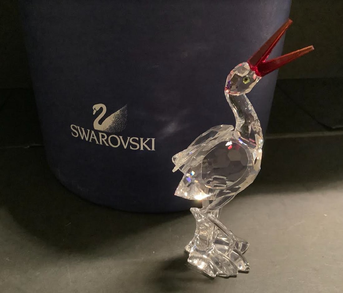 Swarovski Crystal "Cheerful Times" # 659401 figurine in original box: Swarovski Crystal "Cheerful Times" # 659401 figurine in original box. This measures 4.5 inches tall and is in excellent condition but is missing baby.