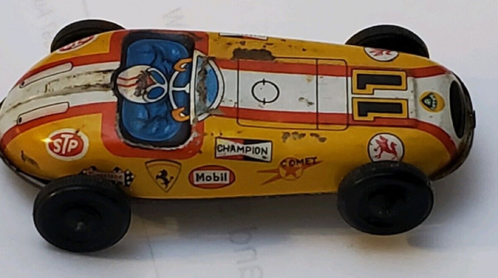 FERRARI Tin Friction Race Car Indy Racer Formula 1 STP Mobil #11 Made in Japan 1950: JAPANESE FERRARI Tin Friction Race Car Indy Racer Formula 1 STP Mobil #11. This Vintage Tin Friction Ferrari Race Car is a true gem for collectors and enthusiasts alike. Made in Japan in the 1950s, it