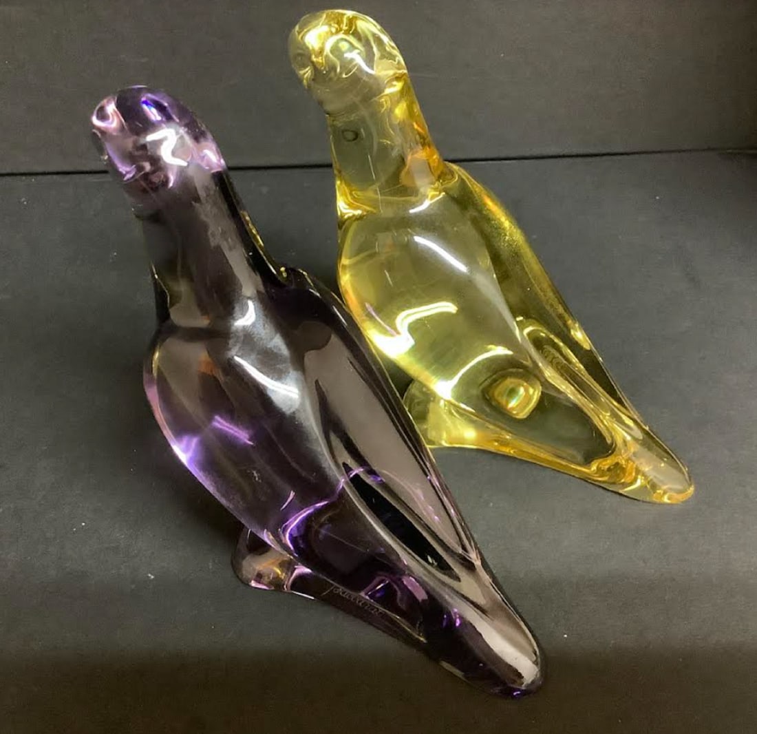 BACCARAT SIGNED PARROT FIGURINES SET OF 2: Baccarat Signed Parrot Figurines, SETO OF 2 Yellow and Purple dimensions are 4.5 inches wide. X 3.5 inches tall