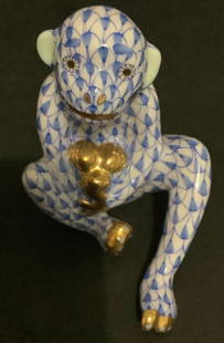 HEREND SIGNED PORCELAIN BLUE FISHNET MONKEY FIGURINE MADE IN HUNGARY: HEREND SIGNED PORCELAI BLUE FISHNET MONKEY FIGURINE MADE IN HUNGARY. Measurents approx. 8cm Height: approx. 6.5cm