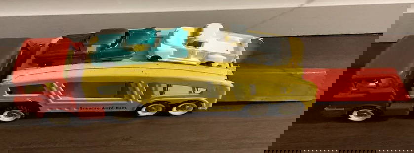 Structo Pressed Steel Auto Haul Loader with two Vehicles: Structo Pressed Steel Auto Haul Loader with two Vehicles. Measures 21 inches long by 5 inches at wides point