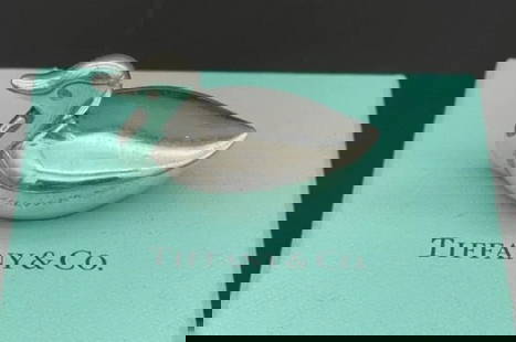 Tiffany & Co. Sterling Silver Duck Figurine Paperweight With Orig Box: Tiffany & Co. Sterling Silver Duck Figurine Paperweight With Orig Box Marked: “TIFFANY & Co MAKERS STERLING”. Weight: 81.1 Grams. Length: 1 10/16 Inches. Height: 1 Inch. Width: 1 Inch.