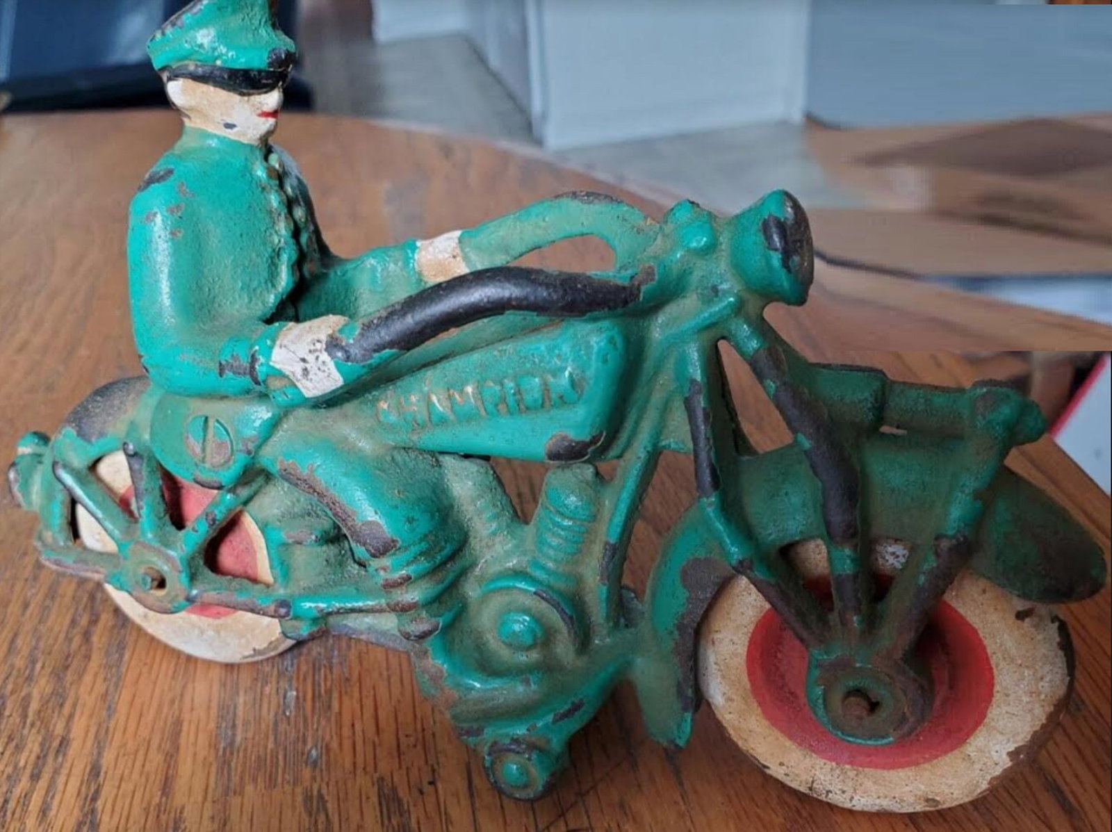 CHAMPION CAST IRON VEHCILE A UNIFORMED PATROL OFFICER ON MOTOR CYCLE 7 INCHES LONG: CHAMPION CAST IRON VEHCILE A UNIFORMED PATROL OFFICER ON MOTOR CYCLE Measures 7 inches long & 4 1/2 high Made in the United States, this collectible piece is perfect for bike and motorcycle enthusiast