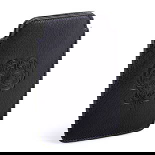 Stephen Webster Black Calfskin Leather iPhone Case 3014092-150: Understated yet undeniably Rock 'n Roll, this decorative skull engraved black leather iPhone case is a stunning phone protector and style accessory that is proudly engraved with the Stephen Webster