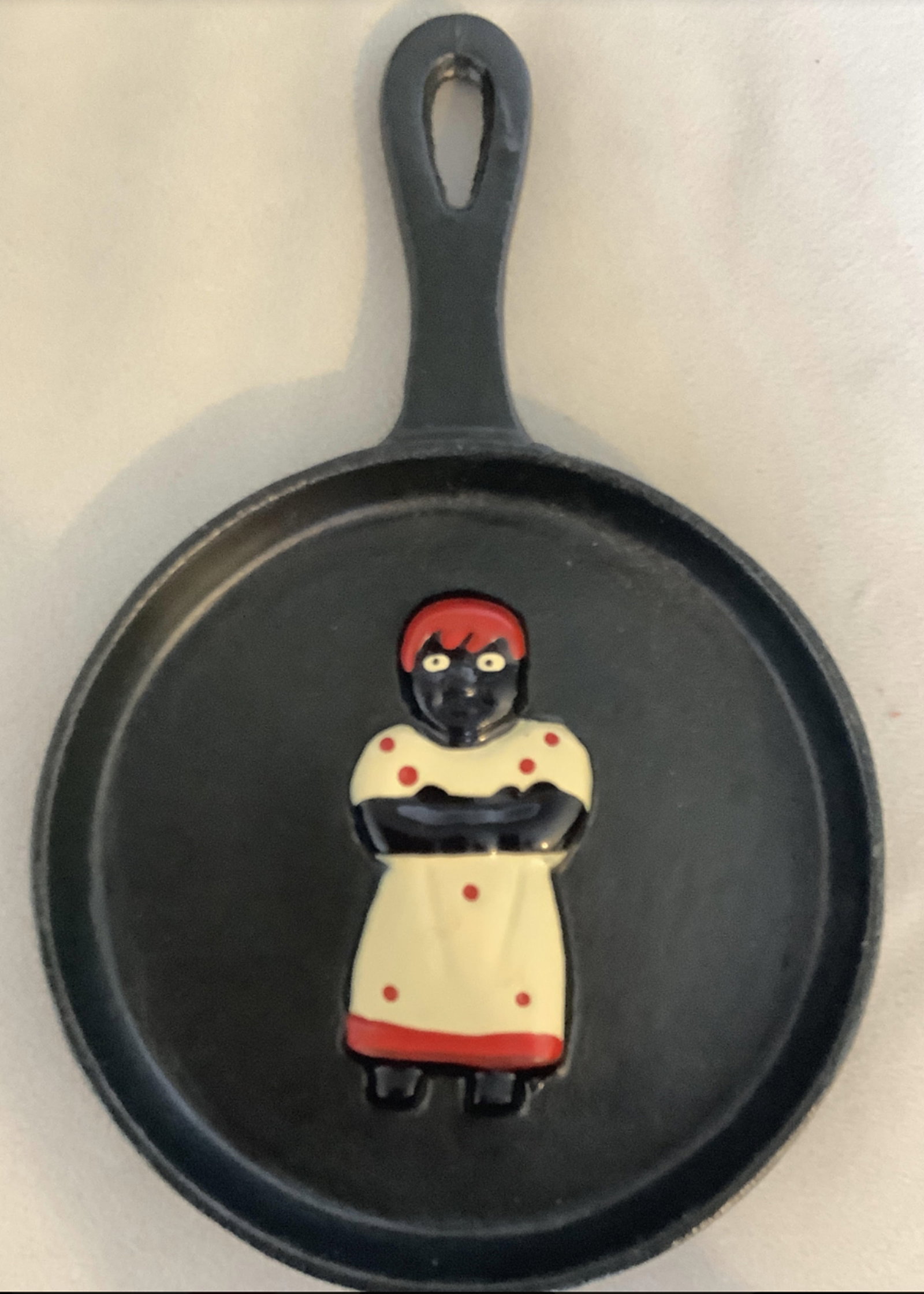 Black Americana Cast Iron Skillet: Black Americana Cast Iron Skillet. Measures approx 7.5 inches tall and 4 3/4 inches wide