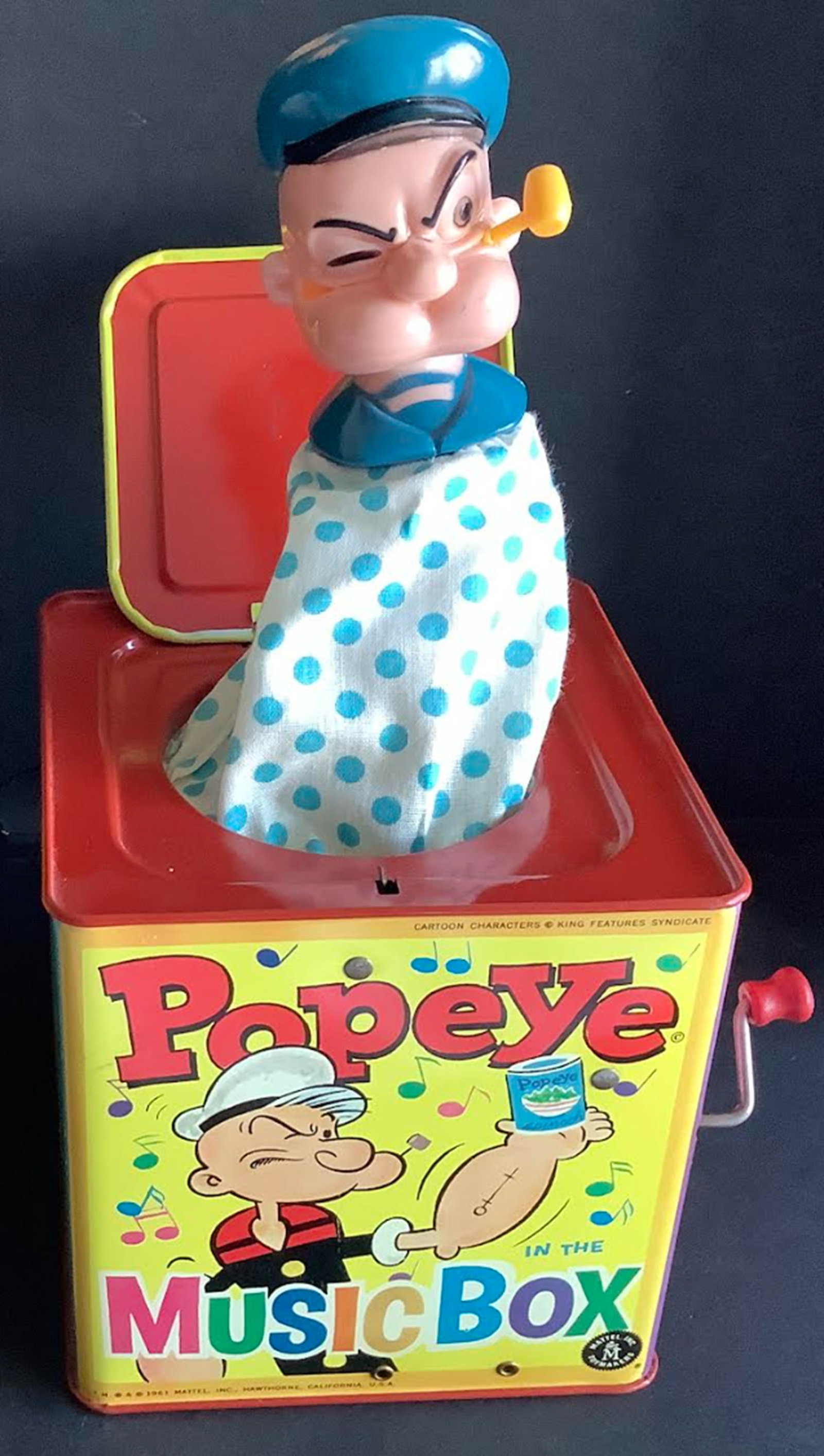 Popeye Musical Surprise box with Orig Box. Mattel 1961: Popeye Musical Surprise box with Orig Box Popeye music boxMeasures approx 5 1/4 inchese wideand 5.5 inches hihg. Box shows some sign of wear due to its age with flap off. The Popeye will pop out when 