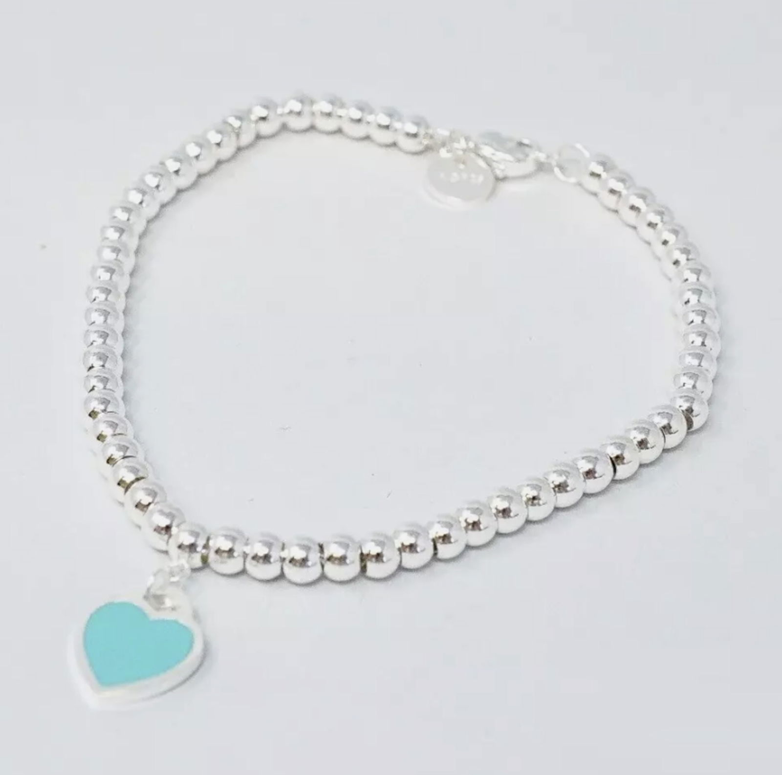 Tiffany & Co. Sterling Silver Blue Enamel Heart Bracelet And Box (1 of 4)