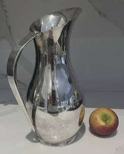 Tiffany & Co Sterling Silver Mid Century Water Pitcher No Monogram: Tiffany & Co Sterling Silver Mid Century Water Pitcher No Monogram. rounded inside of the handle for easy gripping and pouring while retaining the sleek look on the outside of the handle.Over 33 troy