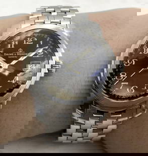Baume & Mercier Stainless Steel Men's Watch MV045214: Baume & Mercier stainless steel men's watch, made in Geneva, with a quartz movement, with a black face and Roman numerals. It measures 36 mm in width excluding the crown