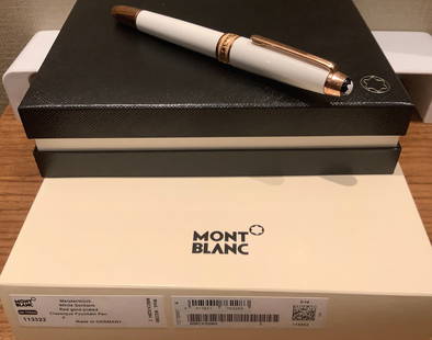 Montblanc Signed White with Rose Gold Meisterstruck Fountain Pen With orig Box.: Montblanc Signed White with Rose Gold Meisterstruck Fountain Pen With orig Box. includes papers. 8 ink cartridges. glass ink bottle. great condition never used. made in Germany