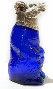 Victorian style French Blue Bear Jug Decanter.: Victorian style French Blue Bear Jug Decanter. The glass body of the Bear is a stunning blue color. The Bear has a silverplated head with glass eyes. The silverplate is stamped on the back of the Bear