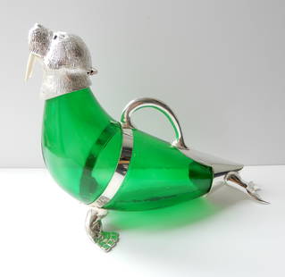 Victorian style French Green Walrus Jug Decanter.: Victorian style French Green Walrus Jug Decanter. The glass body of the walrus is a stunning blue color. The walrus has a silverplated head with glass eyes. The silverplate is stamped on the back of t