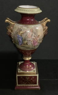 Royal Vienna Handpainted Porcelain vase urn with Makers mark: Royal Vienna Handpainted Porcelain vase urn with Makers mark. Screw might need to be tightened. Measures approx 9.25 inches tall by 5 inches wide
