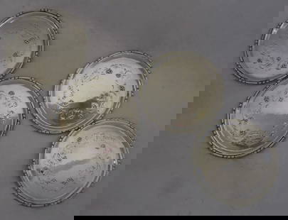 GEORG JENSEN DENMARK SET FOUR (4) STERLING SILVER BUTTER PATS EARLY GI MARK #51: GEORG JENSEN STERLING SILVER DENMARK SET PAT TRAYS EARLY GI MARK #51. the field decorated with raised leaves and berries, 2 3/8 inches in diameter, unmonogrammed, marked with GI STERLING DENMARK 51 A,
