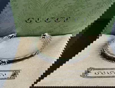 GUCCI Signed Sterling Silver Logo Cuff Bracelet Made in Italy: GUCCI Signed Sterling Silver Logo Cuff Bracelet Made in Italy Diameter, about 2.43" Gucci presents an elegant cuff bracelet crafted of sterling silver, featuring a refined logo that adds a touch of ic