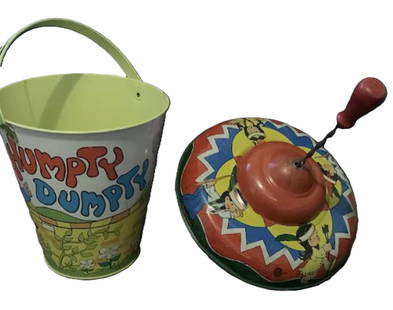 OHION ARTS TIN FRICTION SPIN WHEEL TOY And Ohio Art Studio Humpty Dumpty Sand Pail: OHION ARTS TIN FRICTION SPIN WHEEL TOY And Ohio Art Studio Humpty Dumpty Sand Pail. OHION ARTS TIN FRICTION SPIN WHEEL TOY MEASURES APPROX 9.25 INCHES Ohio Art Studio Humpty Dumpty Sand Pail Measures