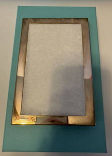 Tiffany & Co Sterling Silver Picture Frame with Pouch And Box: Tiffany & Co Sterling Silver Picture Frame with Pouch And Box. Measures approx 4 by 6 inches. great collectible
