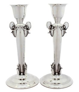 Georg Jensen Sterling Silver Candlesticks: Georg Jensen Sterling Silver Candlesticks. Height: 10 in (25.4 cm)Width: 4 in (10.16 cm)Depth: 4 in (10.16 cm) These candlesticks have all three signature elements. They are lightly hammered and have