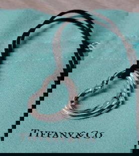 Tiffany & Co Sterling Silver Elsa Peretti Cord Heart with Diamond Pendant Necklace: Tiffany & Co Sterling Silver Elsa Peretti Cord Heart with Diamond Pendant Necklace 18" Weighs 5.3 grams Cord measures 18" longHeart measures 20x22mm Features one single round brilliant diamond, approx